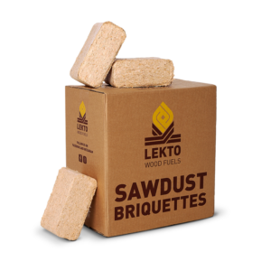 large cardboard box with some sawdust briquettes beside and on top of it, text on box reads "Lekto wood fuels, sawdust briquettes,"